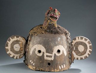 Helmet mask with beaded animal
