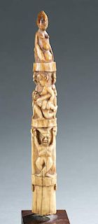 Ivory tusk carving with figures