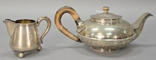 Sterling silver teapot and creamer, teapot marked 12, anchor, and Wm.?, creamer marked 875.  creamer: ht. 3 1/2in.  teapot: ht....
