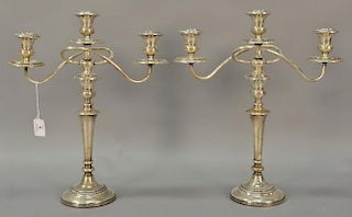 Pair of sterling silver weighted candelabra. ht. 17 1/2in.