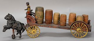 Wilkins cast iron and pressed steel horse drawn dray wagon having seven wooden barrels, one with label "Gold Medal", driver in derby...