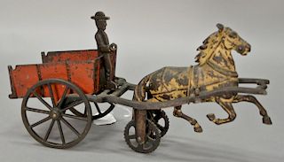 Early Carpenter cast iron tip coal cart circa 1885, pat. May 25 80 82 83 and 84, cart is fitted with tipping mechanism and the bed i...