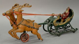 Cast iron Hubley Santa Claus in sleigh being pulled by two deer, Santa with movable arms. lg. 17in.