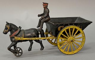 Cast iron horse drawn coal cart pull toy with one horse and driver, stamped on bottom: 038. ht. 6 3/4in., lg. 11 1/2in.