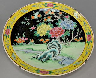 Chinese famille rose porcelain charger having yellow border with flowers and painted center panel with blossoming flowers. dia. 18 1...