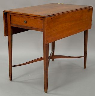 Federal cherry drop leaf Pembroke table with drawer on square tapered legs and arched stretchers, circa 1790. ht. 28 1/2in., wd. clo...