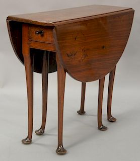 Queen Anne diminutive drop leaf walnut table having oval drop leaves with drawer, set on six turned legs ending in pad feet, circa 1...