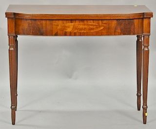 Sheraton mahogany game table having D shaped top over conforming frieze with oval panel inlay all set on turned and fluted legs, cir...