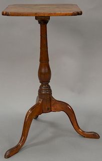 Federal cherry candlestand with shaped top over turned shaft set on tripod base, circa 1790. ht. 26 1/2in., top 13 1/4" x 13 3/4"  P...