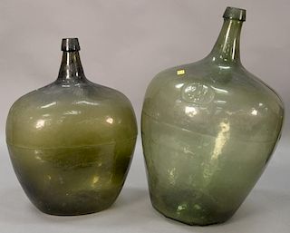 Two large early bottles, olive green, 19th century. ht. 18 1/2in. & 19in.