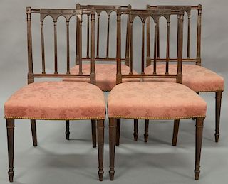 Set of four Sheraton mahogany side chairs with fluted posts, having fully upholstered seats and turned legs. ht. 35in.