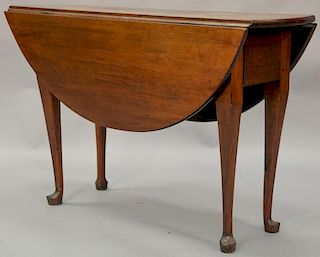 Queen Anne cherry table with oval drop leaves, circa 1750. ht. 28in., lg. 43in., top open: 42 1/2" x 43"