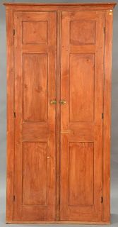 Primitive cupboard having two recessed panel doors opening to interior with five shelves. ht. 86in., wd. 41in., dp. 15in.
