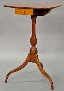 Federal cherry candlestand having shaped top over drawer set on turned shaft with urn, all on spider tripod base, New England circa ...
