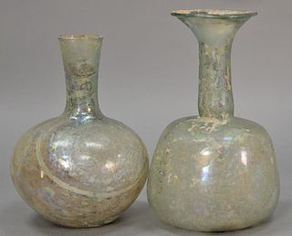 Two large Roman glass bottle vases, pale green and iridescent, 2nd-5th century A.D. ht. 6in. to 6 1/2in.