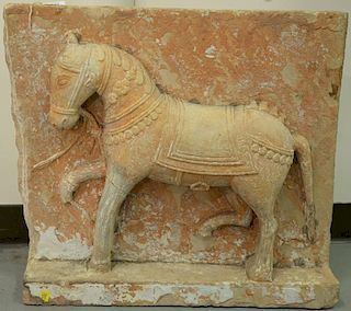 Large carved sandstone plaque with three dimensional horse, possibly Tang. ht. 21 1/2in., wd. 24 1/2in.