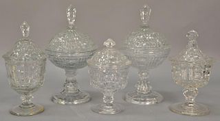 Five covered Waffle pattern flint glass compotes. ht. 9in. to 12in.