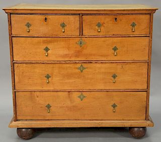 Queen Anne chest with two short drawers over three long drawers set on replaced ball feet, circa 1740. ht. 34 1/2in., wd. 35in., dp....