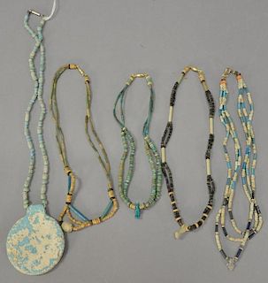 Group of five Egyptian Faience beaded necklaces with small stone pendant figures.