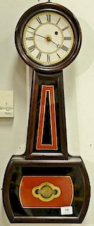 Howard type banjo clock, rosewood case with typical rust black and gilt decoration. ht. 29 1/4in.