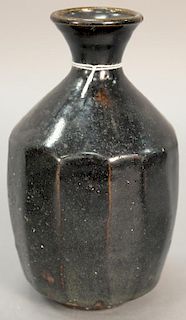 Stoneware monochrome lobed vase, Song Dynasty, with overall black glaze and everted rim ht. 7 1/2in.