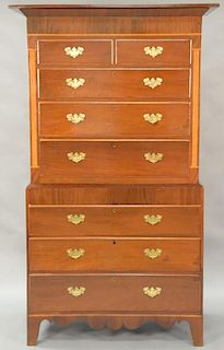 Mahogany chest on chest in two parts, upper section with large cornice molding over two short drawers over three long drawers flanke...