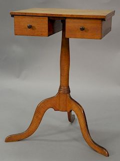 Shaker tiger maple candlestand having square top over two drawers set on plain turned shaft set on tripod base, circa 1800 (top surf...