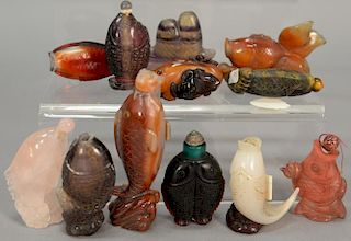 Collection of twelve snuff bottles in the form of fish including quartz, overlay glass, and crystal agate, and one tiger eye.  ht....
