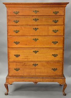 Queen Anne maple and tiger maple chest on frame having large cornice molding over six graduated drawers all set on base with center ...