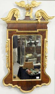 Chippendale mahogany mirror having broken arch top with gilt bird over mirror flanked by fruit and leaves, all with gilt trim, 18th ...
