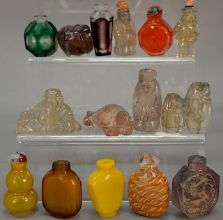 Fifteen glass, crystal, and quartz snuff bottles, some possibly Peking glass.  ht. 1 1/4in. to 2 3/4in.
