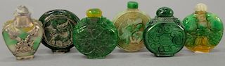 Six carved jadeite and jade snuff bottles. ht. 2 1/4in.
