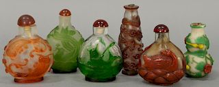 Six overlay glass snuff bottles to include two green overlay, one double gourd multi-color, and three reddish overlay clear glass, e...