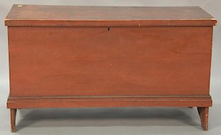 Primitive lift top blanket chest with molded lid and molded trim set on bootjack ends, retaining original red finish, 18th century. ...