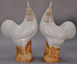 Pair of Oriental porcelain roosters having a white glazed body, salt glazed head, and light brown glazed legs with seal mark on bott...
