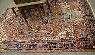 Heriz Oriental area rug (wear). 6'8" x 9'10"