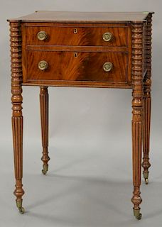 Sheraton mahogany work table with shaped top over two drawers on turned and fluted legs, circa 1830. ht. 30in., top: 16 1/2" x 18 3/...