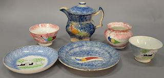 Seven piece spatterware lot to include two cups, saucer with plate, sugar, creamer, one cover, cup and saucer with buildings, four p...