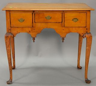 Queen Anne cherry lowboy having three drawers on cabriole legs ending in pad feet, circa 1740, (new top). ht. 28 1/4in., wd. 30in., ...