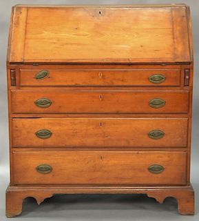 Chippendale cherry desk with slant lid over four drawers set on bracket base, circa 1780. ht. 41in., wd. 35 3/4in.