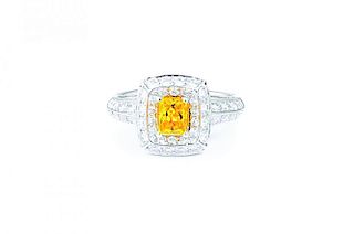 A Fancy Vivid Yellow-Orange Diamond Ring