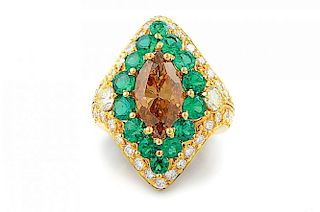 A Fancy Orange-Brown Diamond and Emerald Ring
