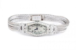 An Art Deco Gold and Diamond Watch, by Longines