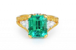 A Diamond and Emerald, Gold and Platinum Ring