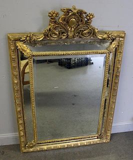 Antique Carved Giltwood Mirror .