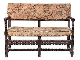 A Carved Settee Height 36 x width 46 x depth 22 inches.