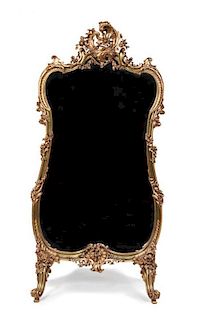 A Louis XV Style Giltwood Cheval Mirror Height 58 1/2 x width 34 1/2 inches.