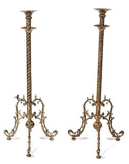 A Pair of Brass Pricket Sticks Height approximately 40 inches.