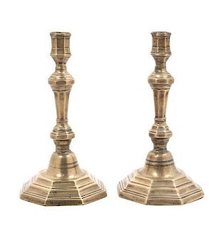 A Pair of George III Brass Candlesticks Height 9 inches.