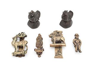 A Collection of Four Brass Door Knockers Length of longest 4 inches.
